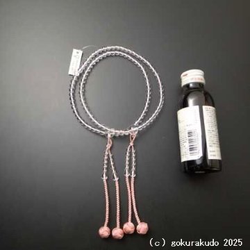 数珠 真言宗 総水晶 尺 珊瑚色利休房の画像