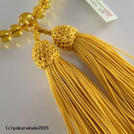 数珠 女性用 黄色ガラス 人絹頭付金茶色房の画像