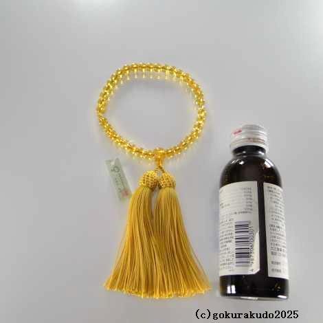 数珠 女性用 黄色ガラス 人絹頭付金茶色房の画像