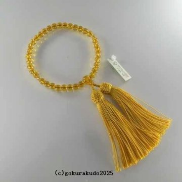 数珠 女性用 黄色ガラス 人絹頭付金茶色房の画像