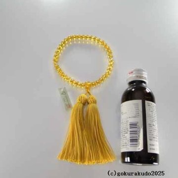 数珠 女性用 黄色ガラス 人絹頭付金茶色房の画像