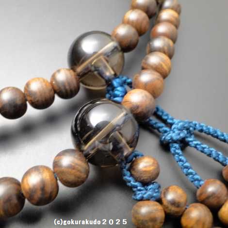 数珠 日蓮宗・法華宗 主玉(おもだま)栴檀、 (親・四天・つゆ)茶水晶、尺2 鉄紺色利休房の画像