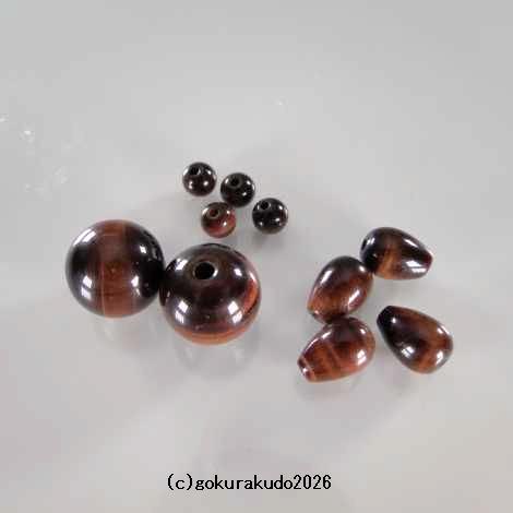 (数珠部品) 日蓮宗、尺２数珠用の(親・四天・つゆ)　赤虎目製の画像