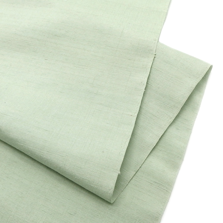 ＜お仕立て代込＞本場久米島紬（織り手：島袋伸子） 「ウージ染・無地」 着尺 白緑色の画像
