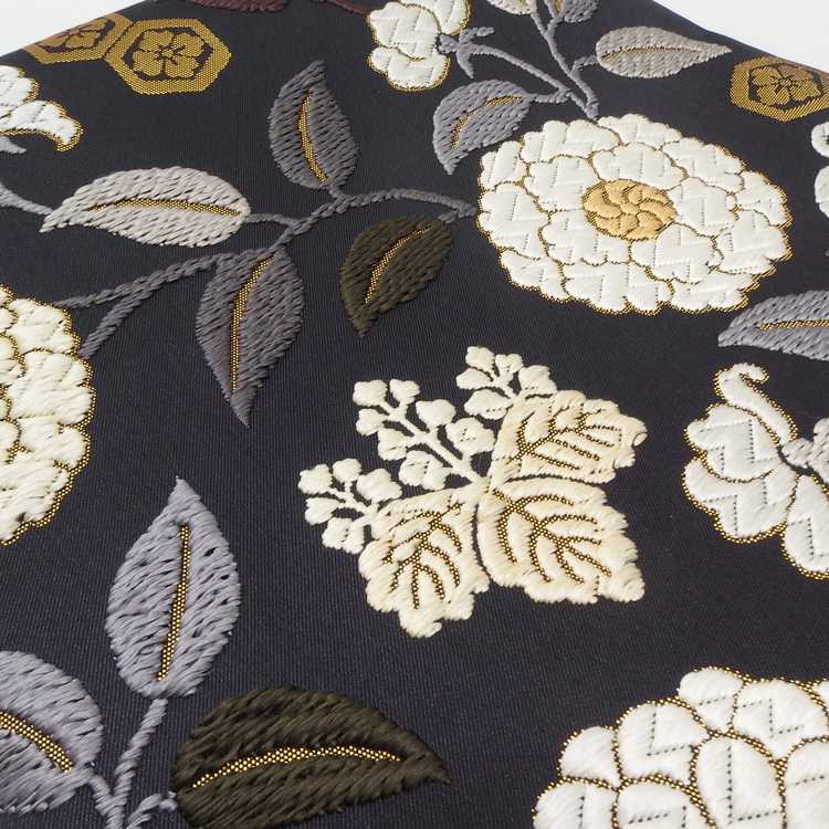 ＜お仕立て代込＞鈴木織物 「菊に桐椿唐草文様」 唐綾錦 袋帯 烏羽色（黒に近い・紫みの濃茶）の画像