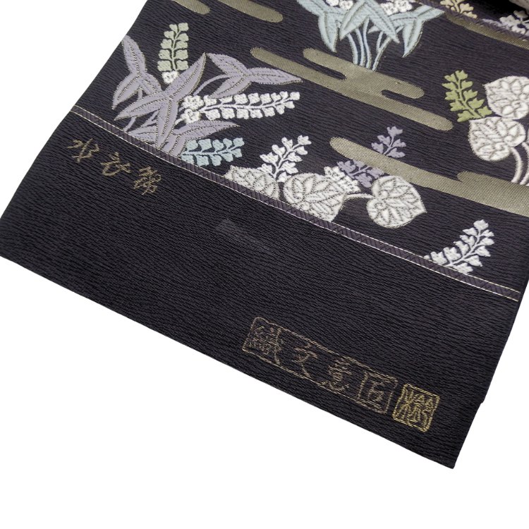 ＜お仕立て代込＞鈴木織物 「霞と葵」 水衣錦 袋帯 焦茶（紫がかった、濃いめの灰茶色）の画像