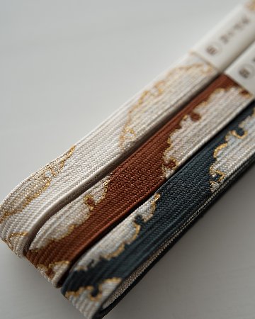 渡敬 帯締め 高麗片胴雪輪撚房 墨色・金糸＜即日発送可＞の画像