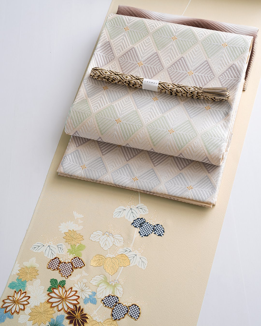 千成堂着物店 帯締め 「手組唐組・切房 別注」 生成・白よごしに濃茶・金糸＜即日発送可＞の画像