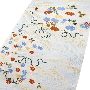 ＜お仕立て代込＞勝山さと子 「流水花束紋」 九寸名古屋帯 桜草木 / 白・灰水色と橙に金糸 の画像