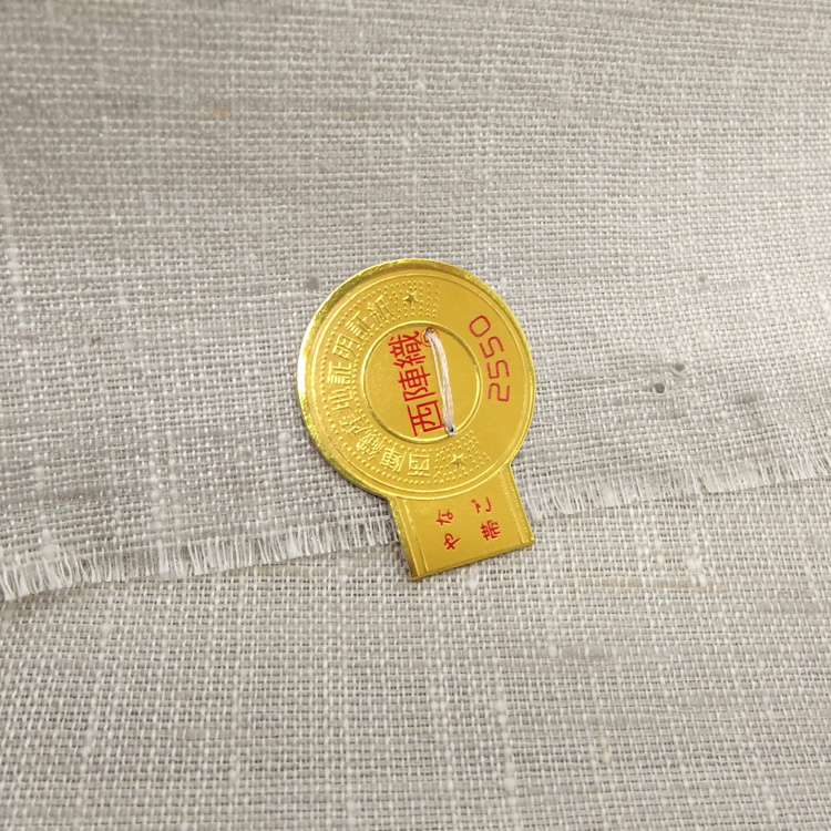 ＜お仕立て代込＞齋藤織物（さいとうおりもの）「垂飾横段唐草」名古屋帯 灰生成色の画像